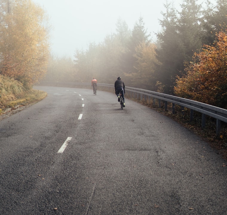 Cyclists on a misty road