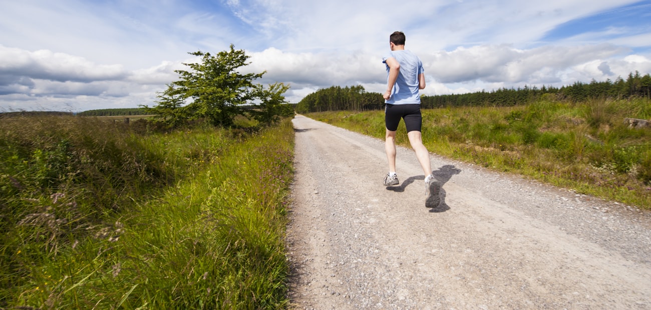A runner on an open gravel road