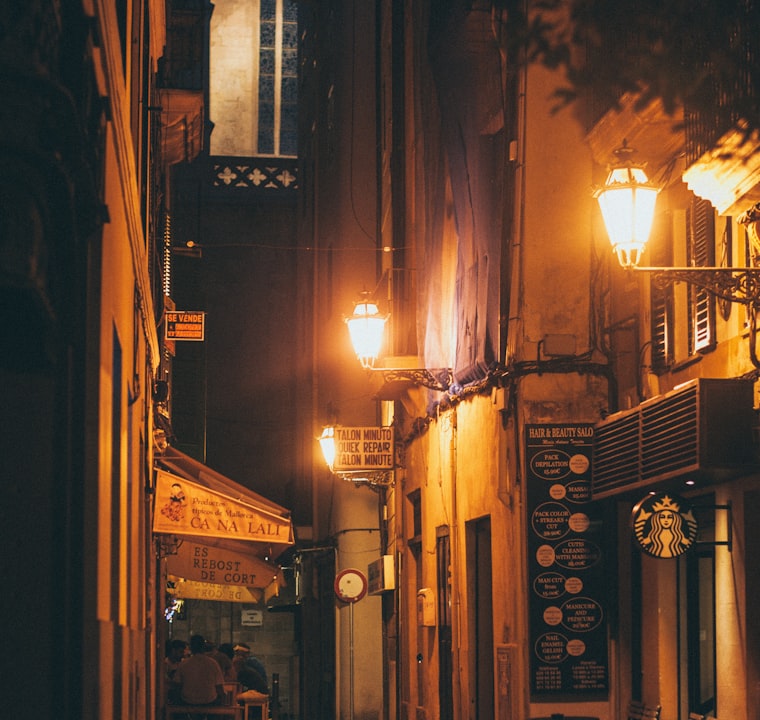 A warmly lit street at night